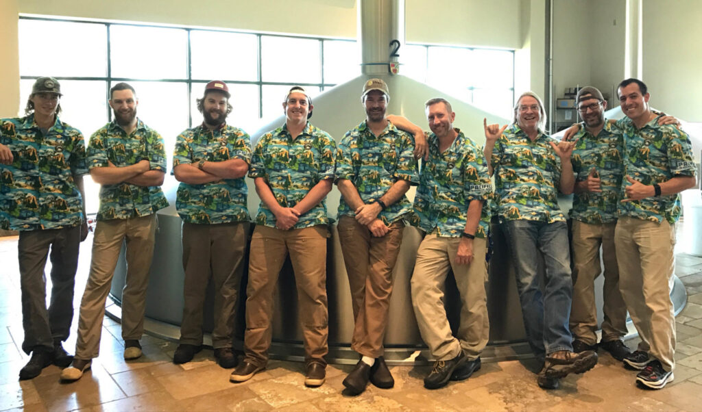 Group photo of Deschutes Brewery team wearing custom print Hawaiian shirts