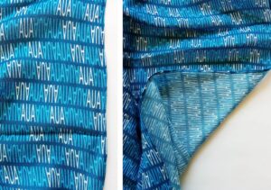 blue and white text design on a modal custom scarf