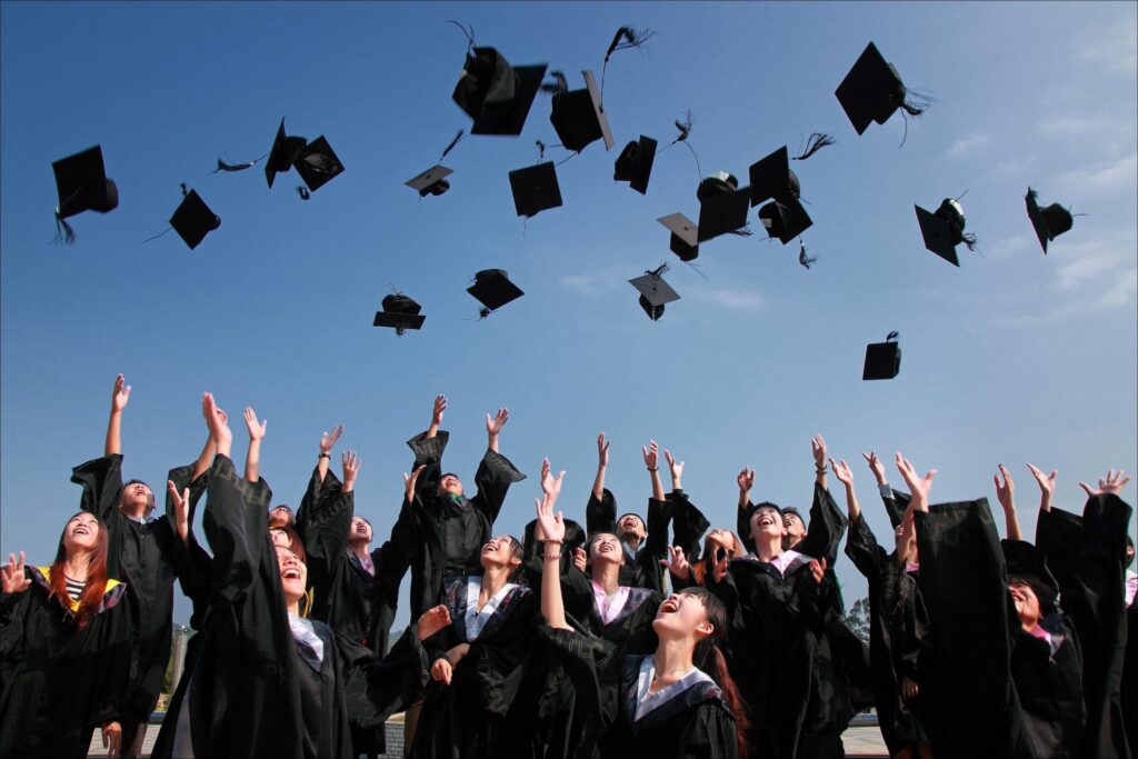 Photo of graduating class tossing hats