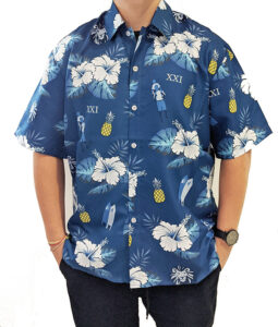 model wearing blue men's Hawaiian shirt with pineapples and floral print
