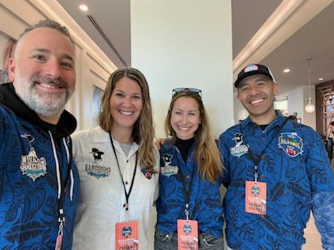 Candor Threads CEO Becky Galvez with her husband Diego, Marketing Director- Sandra Schustack, and her husband, Rob. Sporting the official Hawaiian shirts of the 2023 Hula Bowl!