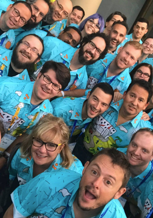 Group photo of employees wearing custom printed Hawaiian shirts