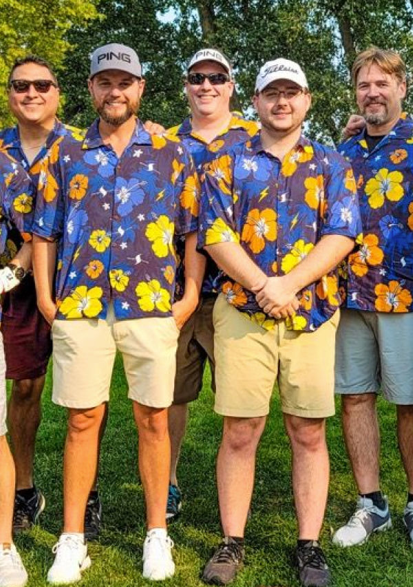 Photo of several men wearing custom printed Hawaiian shirts