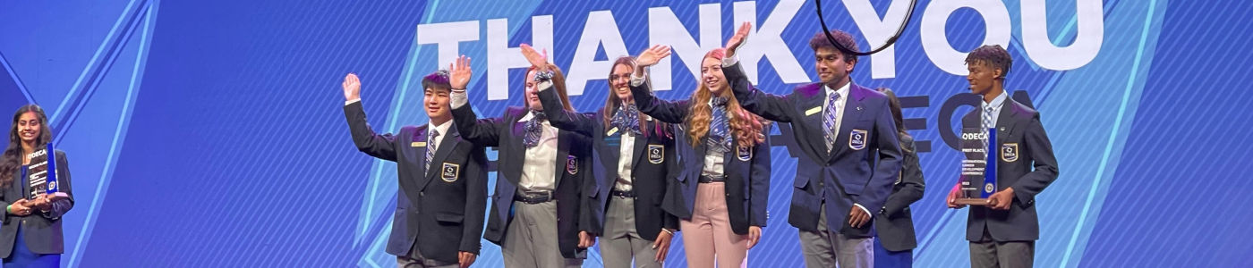 Photo of DECA members on stage