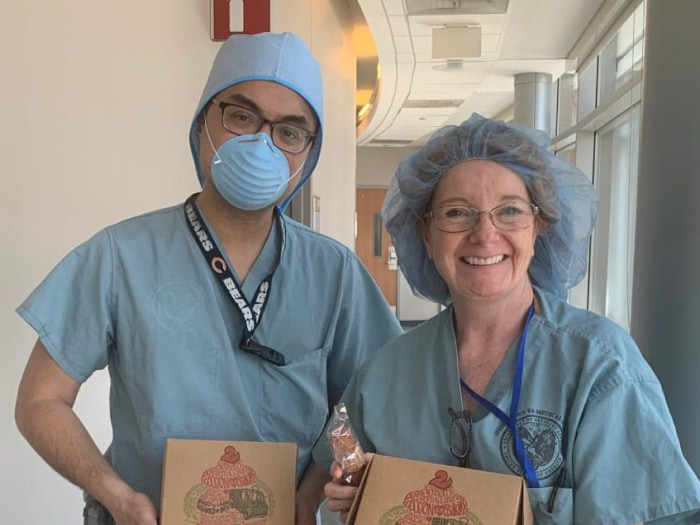 Photo of medical workers holding donated treats