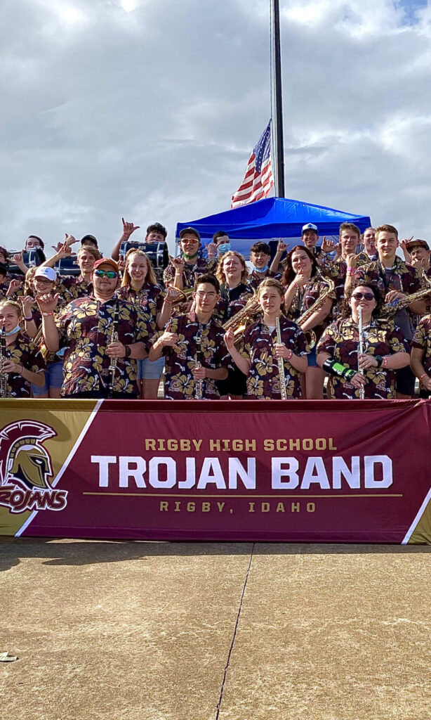 Group photo of Rigby High School Marching Band wearing custom Hawaiian shirts