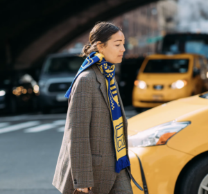 Knit scarf on woman crossing street