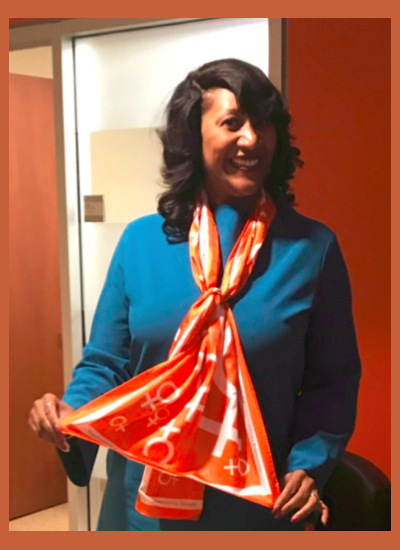 YWCA Chicago CEO Dorri McWhorter showing off her YWCA scarf! Read more at the YWCA Metropolitan Chicago customer spotlight YWCA Chicago CEO Dorri McWhorter showing off her orange YWCA scarf!
