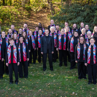 Group photo of Together in Hope Choir wearing custom print scarves