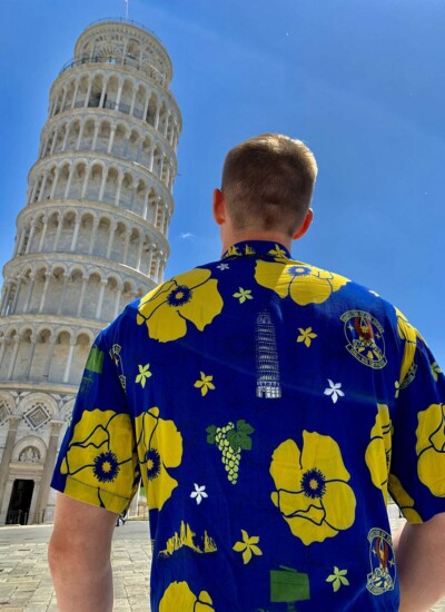 606th Air Control Squadron weaving the Leaning Tower of Pisa into their Candor Threads Hawaiian Shirt design Photo of 606th Air Control Squadron member wearing custom print Hawaiian shirt in front of Leaning Tower of Pisa