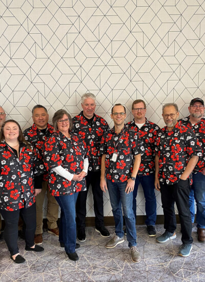 "Hi Becky, I wanted to share a picture with you of the Holman leadership team in our fantastic Candor Threads Hawaiian shirts! We purchased these shirts from you late last year as gifts for our leadership team and our extended management at our locations across the U.S. To say “They are a big hit” - is a huge understatement! The team loves them, our President is thrilled with them, and I enjoyed working with you and the Candor Threads team through the whole process.
You have a great mission, and a great product. I’ll be ordering again!" Group photo of Holman Logistics team wearing custom Hawaiian shirts