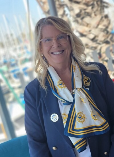 "Rear Commander Mardele after attending another opening day. The new scarves are a hit and making the other clubs take notice." Seal Beach Yacht Club member wearing custom silk scarf