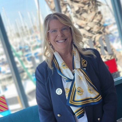 "Rear Commander Mardele after attending another opening day. The new scarves are a hit and making the other clubs take notice." Seal Beach Yacht Club member wearing custom silk scarf