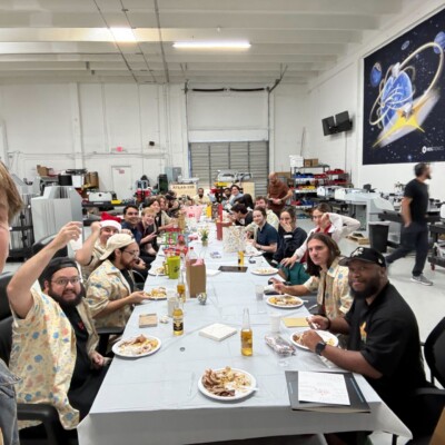 Hi Becky,
That is so sweet and heartwarming! The team LOVES the threads and we wear them all the time. Surprisingly I don't have a professional team photo of everyone wearing them, but here's one from our Christmas party just as we gifted them out. We were so excited to put them on over our clothes! Thank you for the holiday cheer and making my Christmas wishes come true this year with the fast delivery, it really made a difference <3