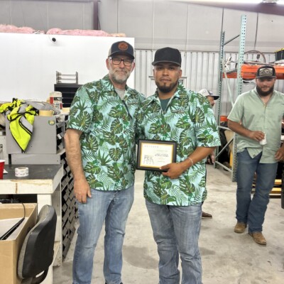 Hi Katie,
We love the shirts! They turned out great.
We don't have a group photo, but a lot of us wore them at our company's taco truck on Friday. Here's a photo of our president, Justin Jones, wearing his while we passed out MVP awards.